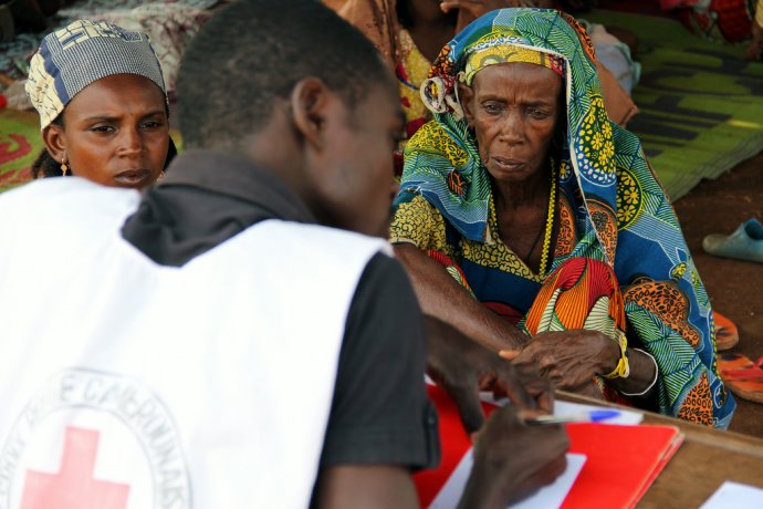 aid worker interviewing CAR refugees in Cameroon