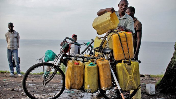 A man loads water collected from Lake Kivu onto his bicycle for sale in Goma, DRC, where municipal supplies have been interrupted